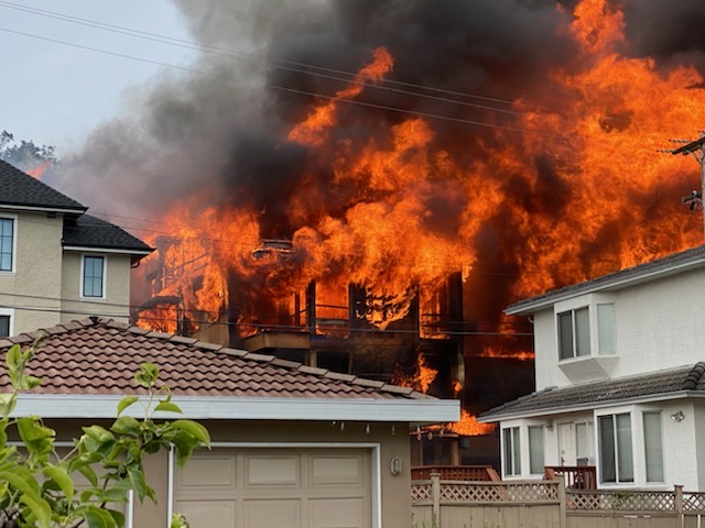 Fire engulfs a four-storey condo building at West 62 Avenue and Columbia Street in south Vancouver on June 18, 2020.