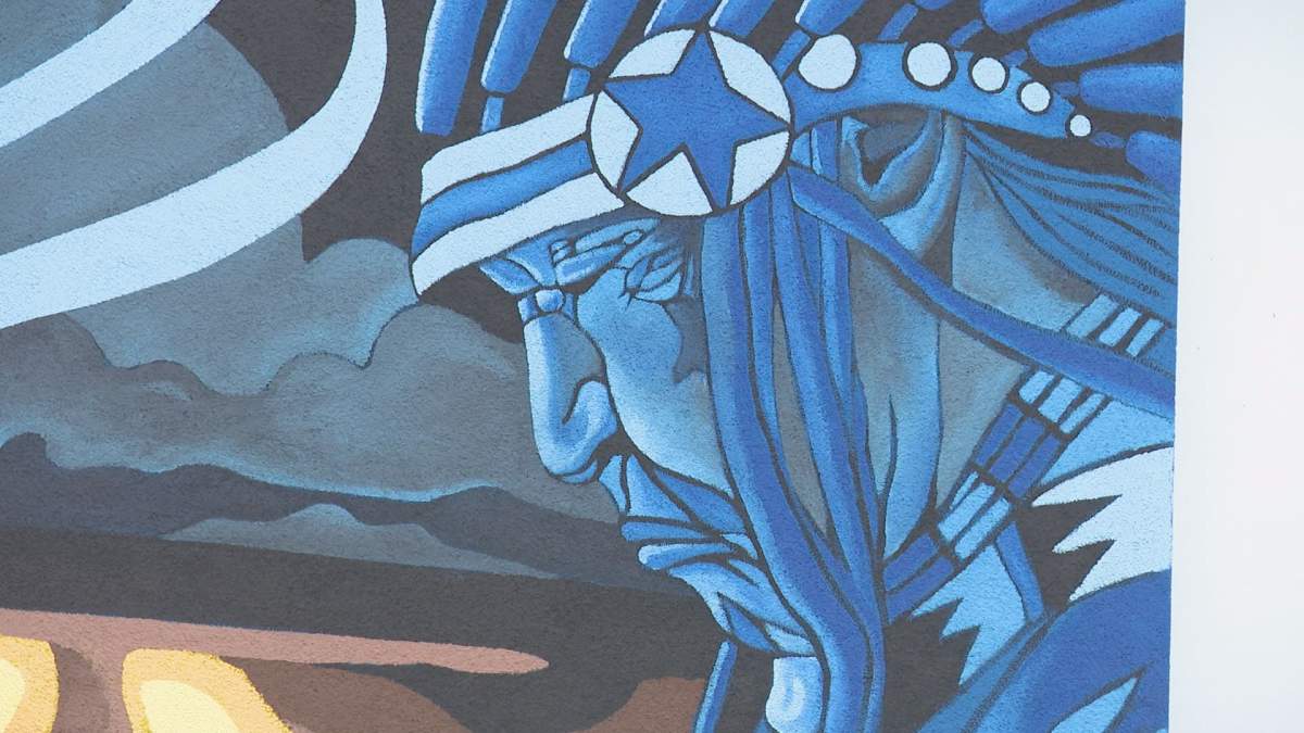 Chief painted on mural.