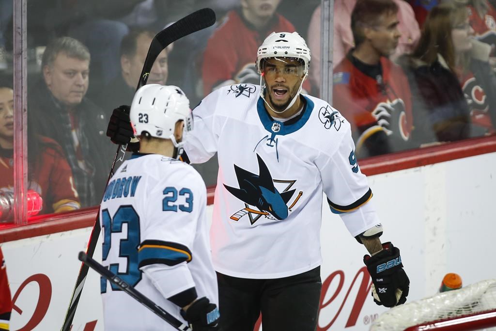 Evander Kane, right, celebrates his goal with teammate Barclay Goodrow during second period NHL hockey action against the Calgary Flames in Calgary on February 4, 2020.