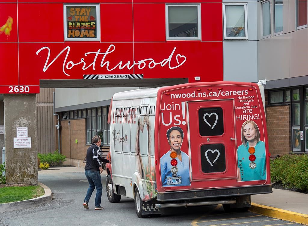 A driver enters a shuttle bus at Northwood Manor, one of the largest nursing homes in Atlantic Canada, in Halifax on Tuesday, June 2, 2020. The Nova Scotia Nurses' Union says pandemic infections and deaths in the province's nursing homes have been a "tragic reminder" of the province's failure to bring in higher staffing levels it recommended four years ago. THE CANADIAN PRESS/Andrew Vaughan.