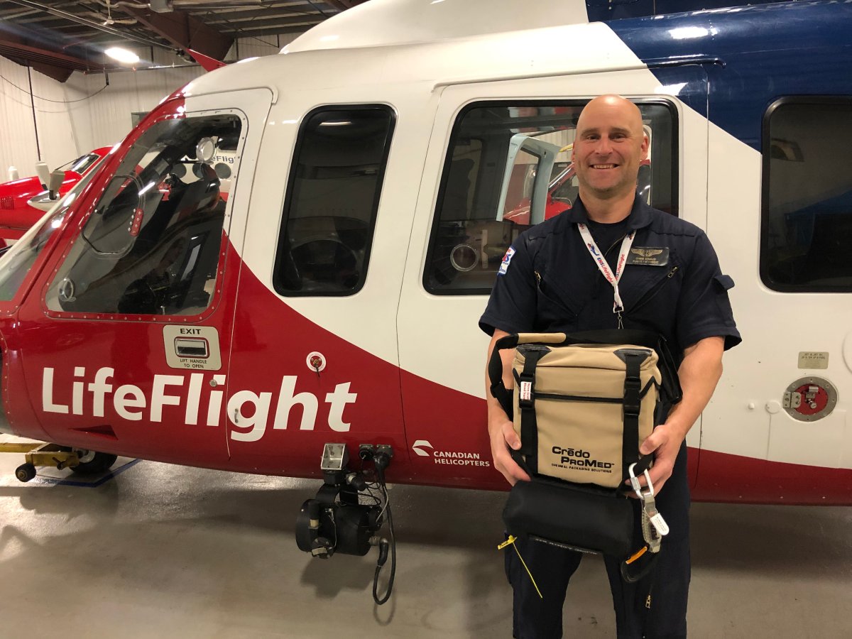 EHS LifeFlight Critical Care Paramedic Chris Renaud holds a blood cooler, as the group launches a new transfusion program.