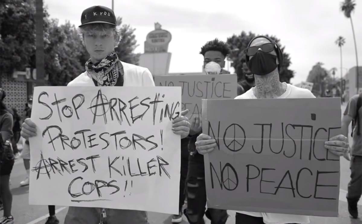 (L-R) American rapper/rock musician Machine Gun Kelly and Blink-182 drummer Travis Barker during a Black Lives Matter protest in the U.S. in 2020.