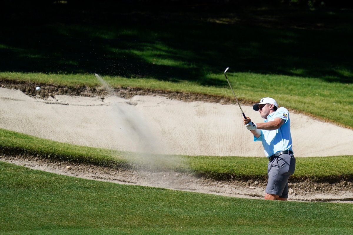 Dundas, Ont. native Mackenzie Hughes hits out of a bunker on the 15th fairway during practice for the Charles Schwab Challenge golf tournament at the Colonial Country Club in Fort Worth, Texas, Wednesday, June 10, 2020.