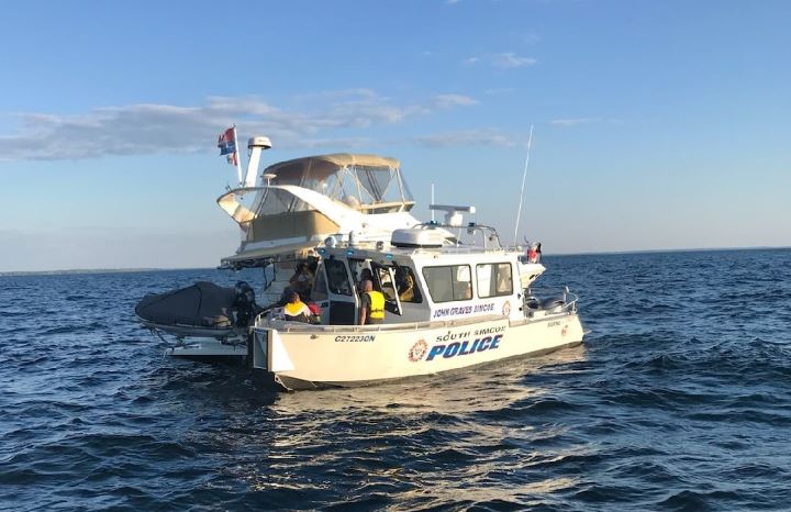 When officers arrived at the scene, police say a civilian vessel was trying to pull a person from the water and that several other people were trying to swim toward the boat.