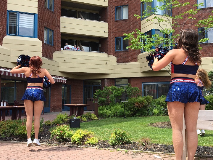 Montreal Alouettes Cheerleaders perform outside a retirement home in Pointe-Claire. Thursday, June 4, 2020.