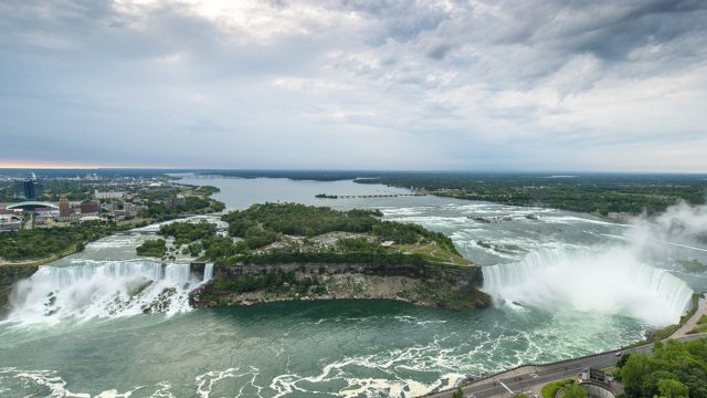 A general view of the Niagara River as it flows into the American Falls (L) in Niagara Falls, USA, and Horseshoe Falls (R) in Niagara Falls, Canada. EPA/WARREN TODA.