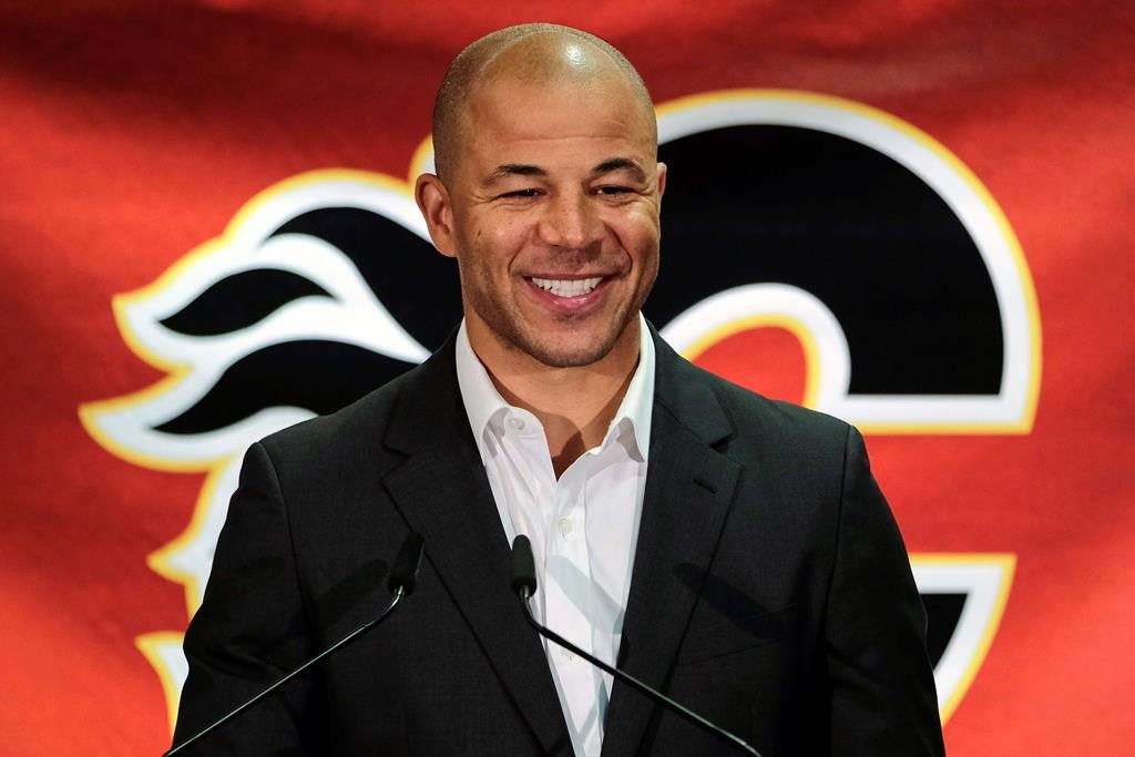 In this July 30, 2018, file photo, former Calgary Flames hockey team captain Jarome Iginla announces his retirement from the NHL at a news conference in Calgary.