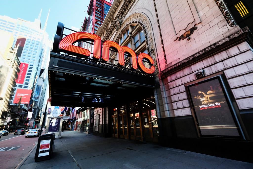 FILE - In this May 13, 2020 file photo, AMC Empire 25 theatre appears on 42nd Street in New York. The nation’s largest movie theater chain changed its position on mask-wearing less than a day after the company became a target on social media for saying it would defer to local governments on the issue. AMC Theaters CEO Adam Aron said Friday that its theaters will require patrons to wear masks upon reopening, which will begin in July. (Photo by Evan Agostini/Invision/AP, File).
