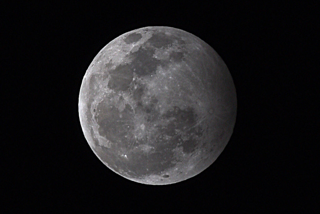 This file photo shows a view of the moon during a penumbral lunar eclipse, on January 10, 2020 in New Delhi, India.