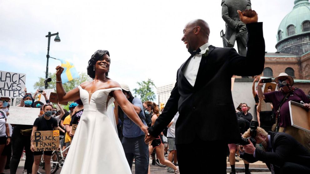 Dr. Kerry Anne Perkins and Michael Gordon were married on June 6 and celebrated by joining the Philadelphia protests.