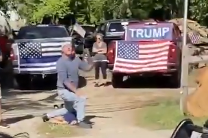 Two white men are shown re-enacting the death of George Floyd, a Black man who died in police custody, while taunting an anti-racism protest in Franklin Township, N.J., on June 8, 2020.