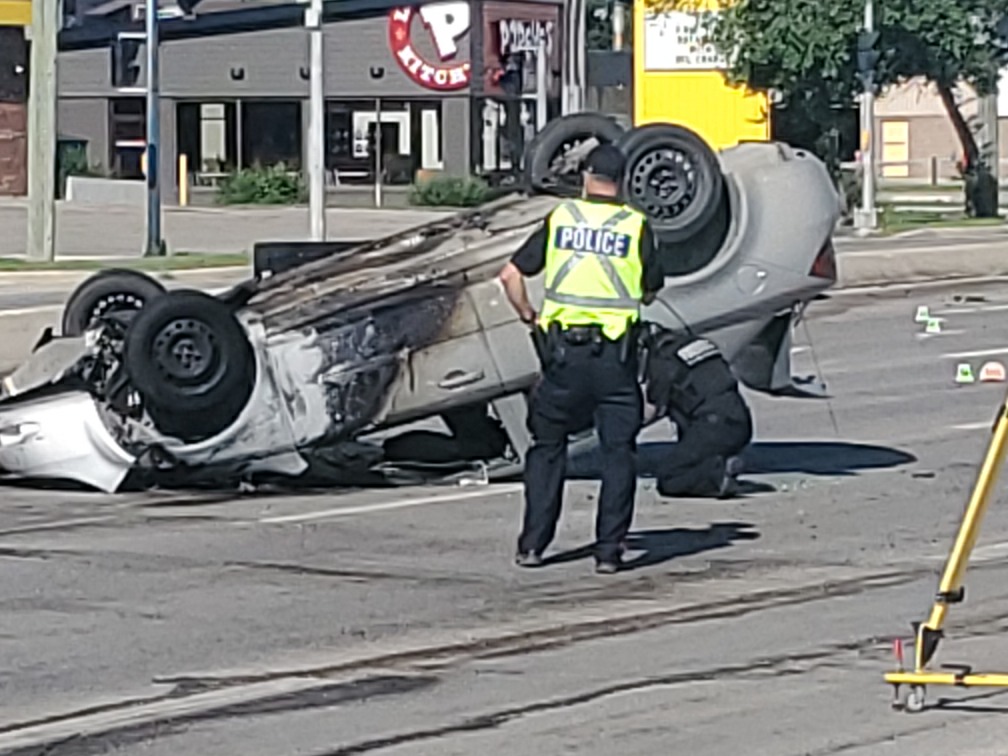 1 taken to hospital after a car flips in Winnipeg crash - image