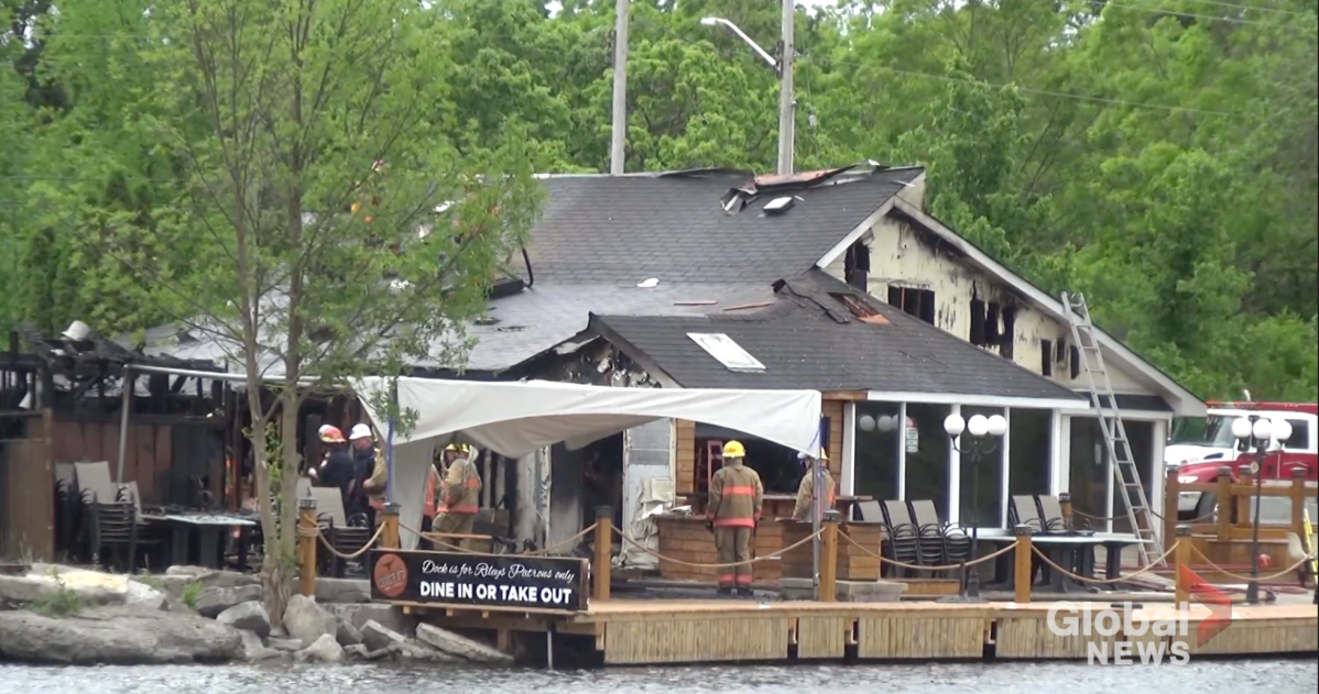 Firefighters assess the scene at Rileys Bar and Grill.