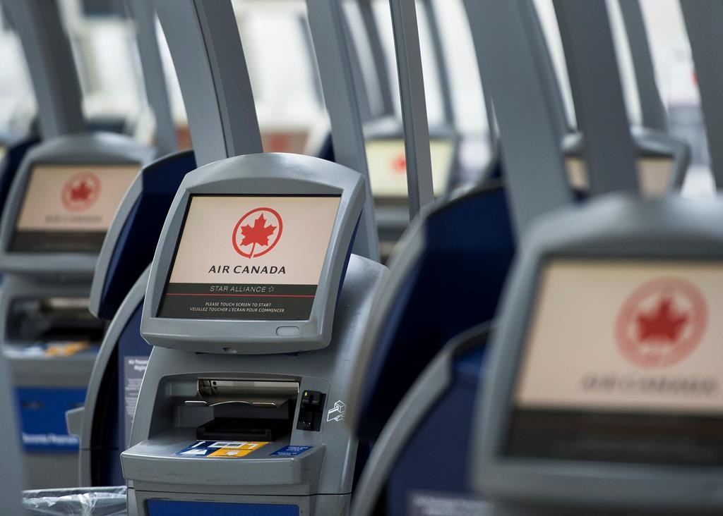 An Air Canada ticketing station is shown at Pearson International Airport in Toronto on Wednesday, April 8, 2020.