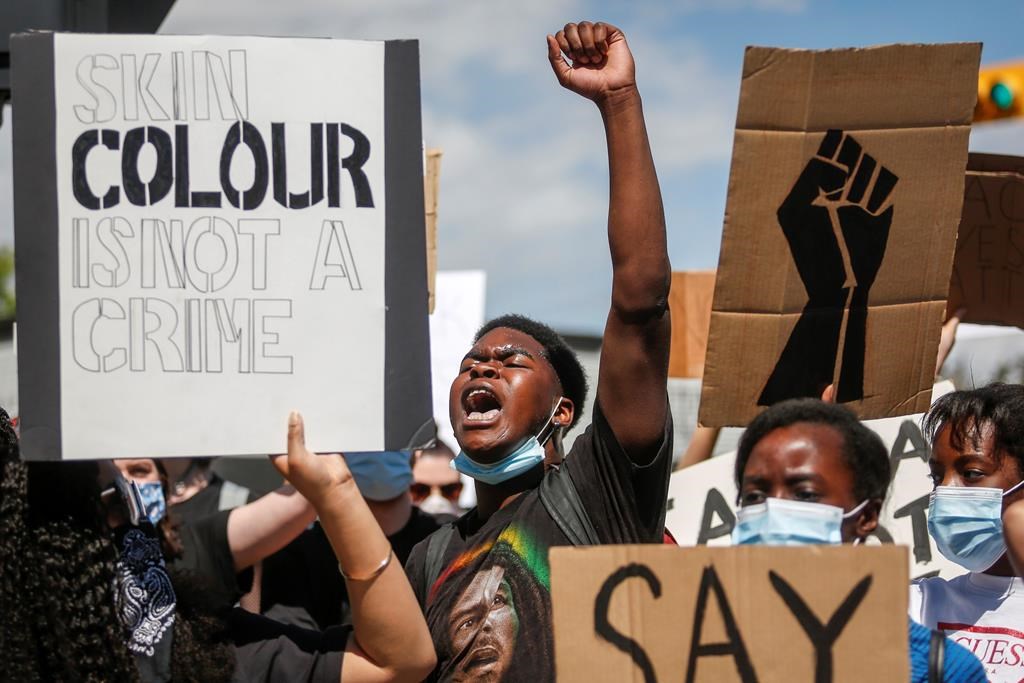 Protesters gather in solidarity with the George Floyd protests across the United States in Calgary, Alta., Wednesday, June 3, 2020.