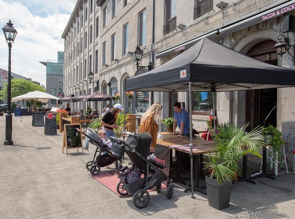 Restaurants and bars offer takeout food and drinks in Old Montreal on Thursday, June 4, 2020.