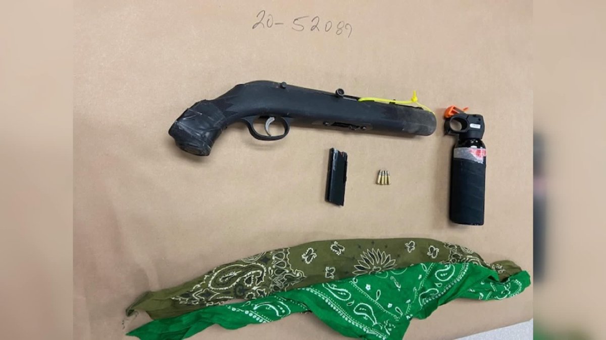 Saskatoon police say a sawed-off rifle, ammunition and bear spray were seized after a firearm was pointed at an officer on June 3, 2020.