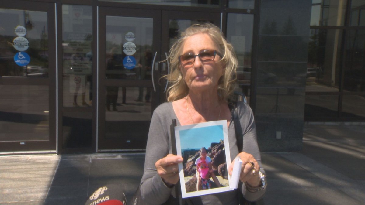 Sharon Kennedy holds a photo of her daughter Candice Kennedy-Faguy, who was killed in September 2018. A sentencing hearing for Claude Francis Blanchard was adjourned Thursday due to a request by the defence lawyer.