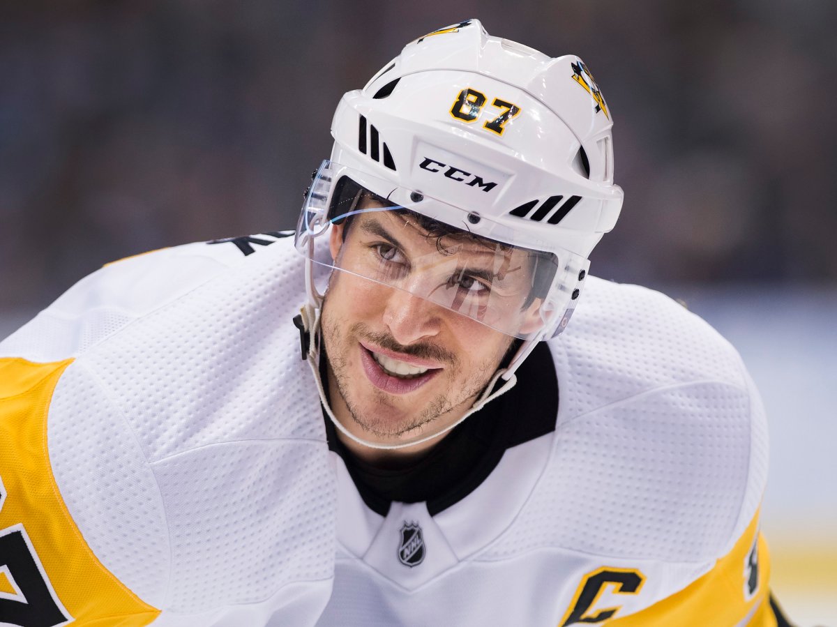 Pittsburgh Penguins centre Sidney Crosby smiles in the faceoff circle while playing against the Toronto Maple Leafs during third-period NHL hockey action in Toronto on Thursday, Feb. 20, 2020.