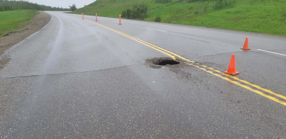 Highway 97 at South Taylor Hill is single lane alternating traffic due to a sinkhole.