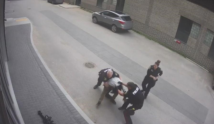 A man seen being kicked by Winnipeg police during his arrest has been sentenced. A framegrab from the video is shown in a handout.