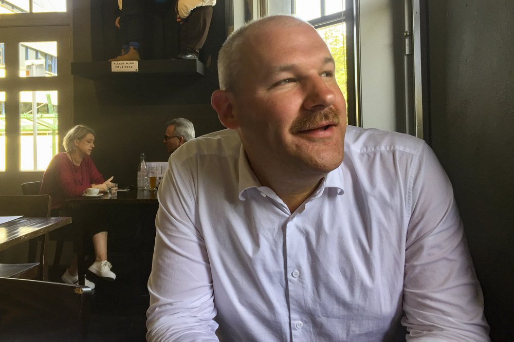 Former National MP Andrew Falloon is seen in a cafe in Wellington, New Zealand, on Dec. 8, 2019. Falloon, a conservative New Zealand lawmaker abruptly resigned Tuesday, July 21, 2020 after allegedly sending pornographic images to at least three women and then lying about what had happened to both his party leader and to police.