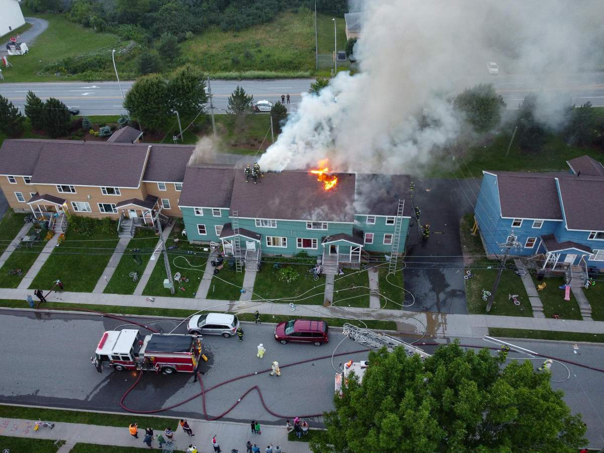 Fire crews work to battle a blaze on MacLaren Boulevard in Saint John on July 28, 2020. 