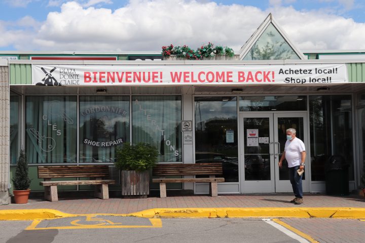 Shopper, Philippe Grenier, walks out of the Pointe-Claire Plaza after completing an errand at the mall’s drugstore on Tuesday, July 21, 2020.