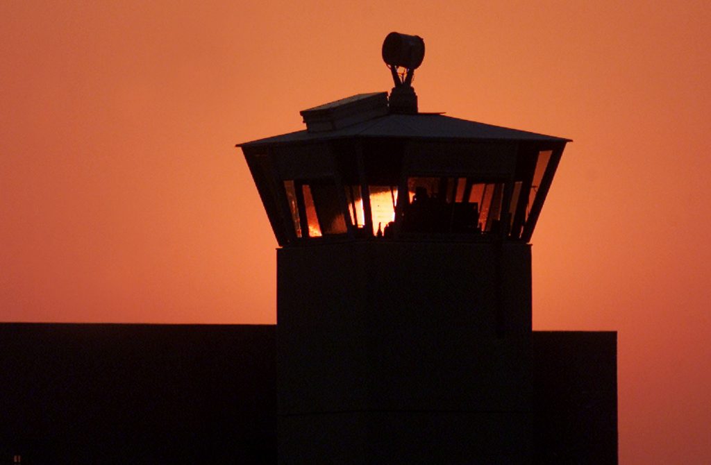 The sun sets behind one of the guard towers at the Federal Penitentiary in Terre Haute, Indiana in this file image. 