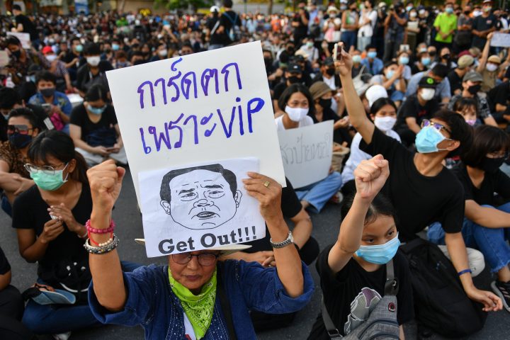 A protester holds a sign depicting Thai Prime Minister Prayuth Chan-Ocha during a protest demanding the resignation of the government, defying the coronavirus disease (COVID-19) restrictions on large gatherings in one of the largest demonstrations since a 2014 army coup in Bangkok, Thailand July 18, 2020. 