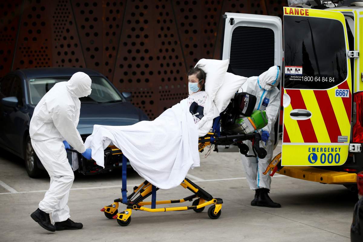 A resident is taken to an ambulance from an aged care facility experiencing an outbreak of the coronavirus disease (COVID-19) in Melbourne, Australia, July 28, 2020.   