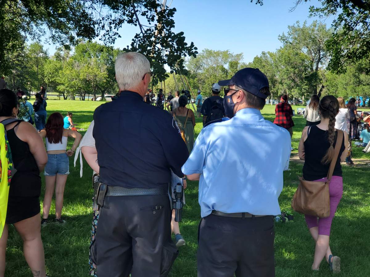 Wascana Centre authorities watch as a tipi is erected on the lawns of the Saskatchewan Legislature.