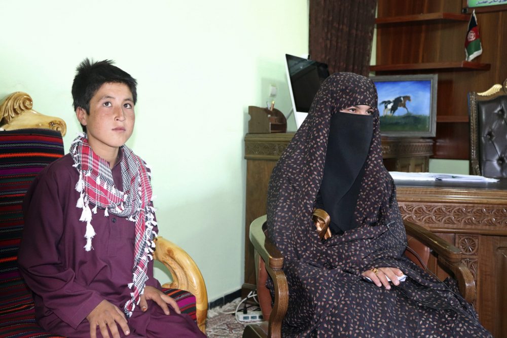 Qamar Gul, 16, right, and her brother Habibullah, 12, pose for a photograph in the governor’s office in Feroz Koh, the provincial capital of Ghor province, in western Afghanistan, Tuesday, July 21, 2020.
