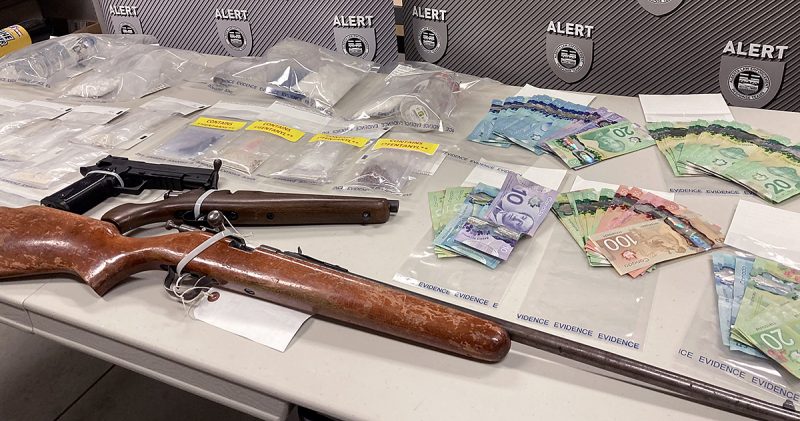 ALERT seized drugs and guns during a search of a home in Innisfail, Alta., on June 25.