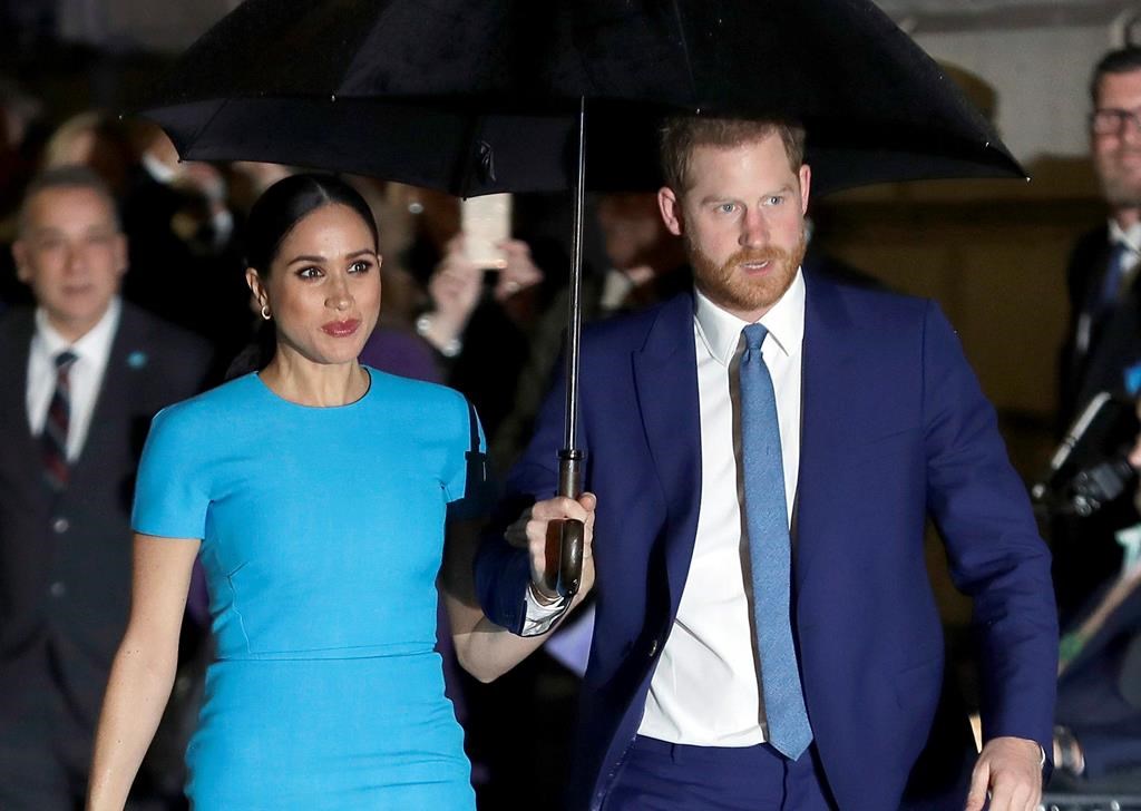 FILE - Prince Harry and Meghan, the Duke and Duchess of Sussex arrive at the annual Endeavour Fund Awards in London on March 5, 2020.