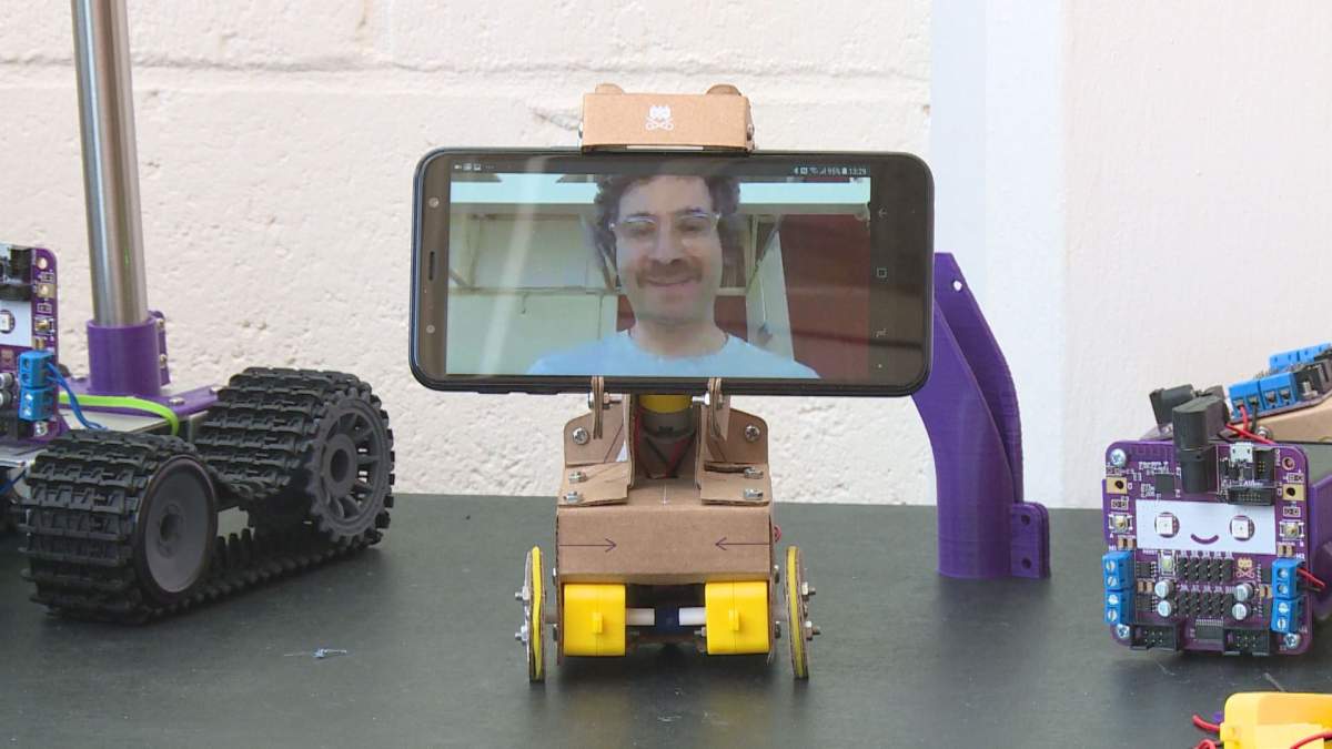 Ross Atkin’s ‘Smartipresence’ device is a self-assembled cardboard robot that allows a video caller to move around the environment of the person they’re calling.