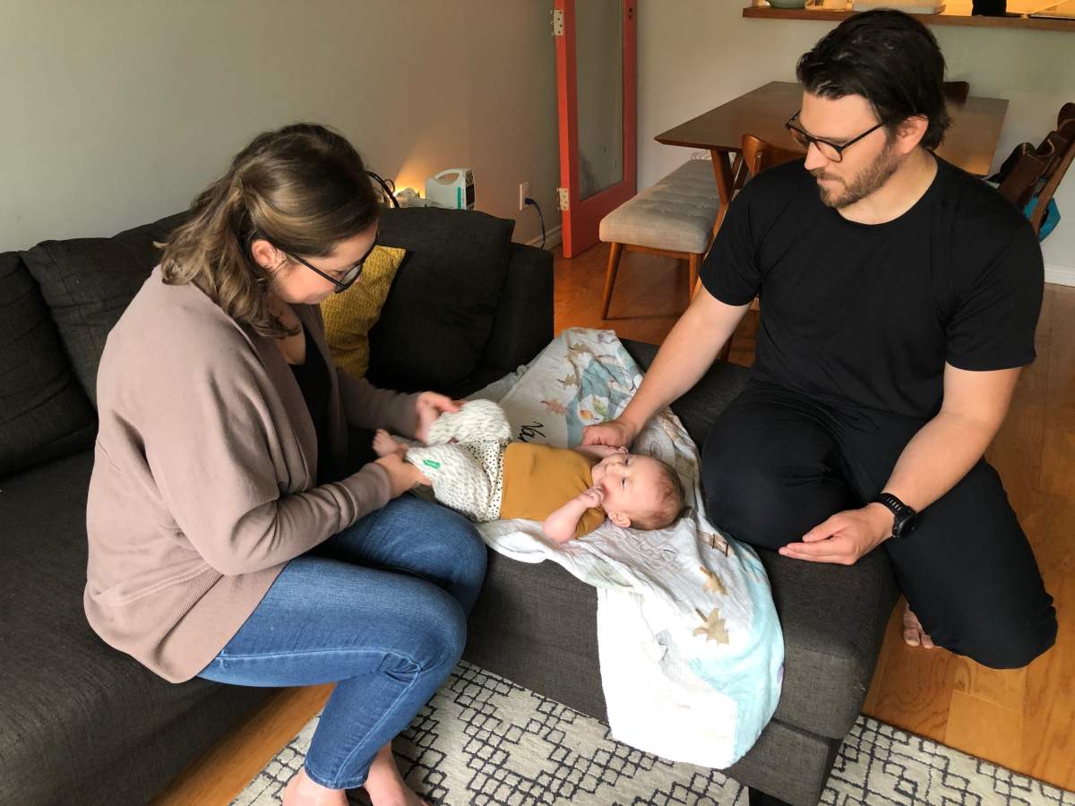 Baby Lucy with her parents Laura and Scott Van Doormaal. Credit: Linda Aylesworth / Global News