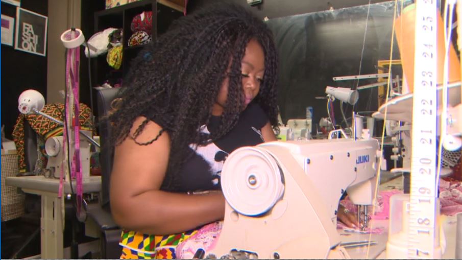 Beni Bouka, owner of Beni Boo Styles in Little Jamaica, works away in her African boutique shop.