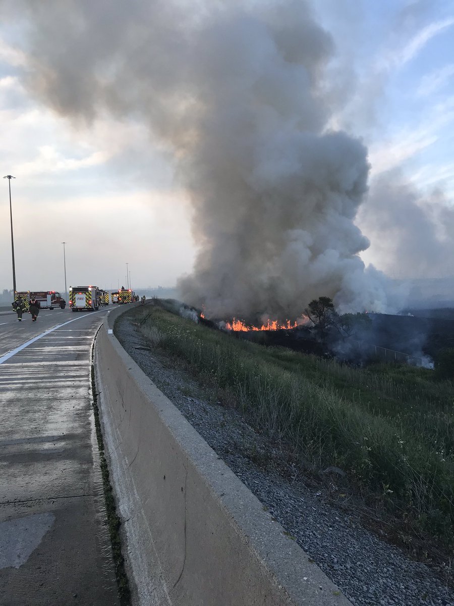 Emergency crews respond to a grass fire near Highways 410 and 407 Thursday evening.