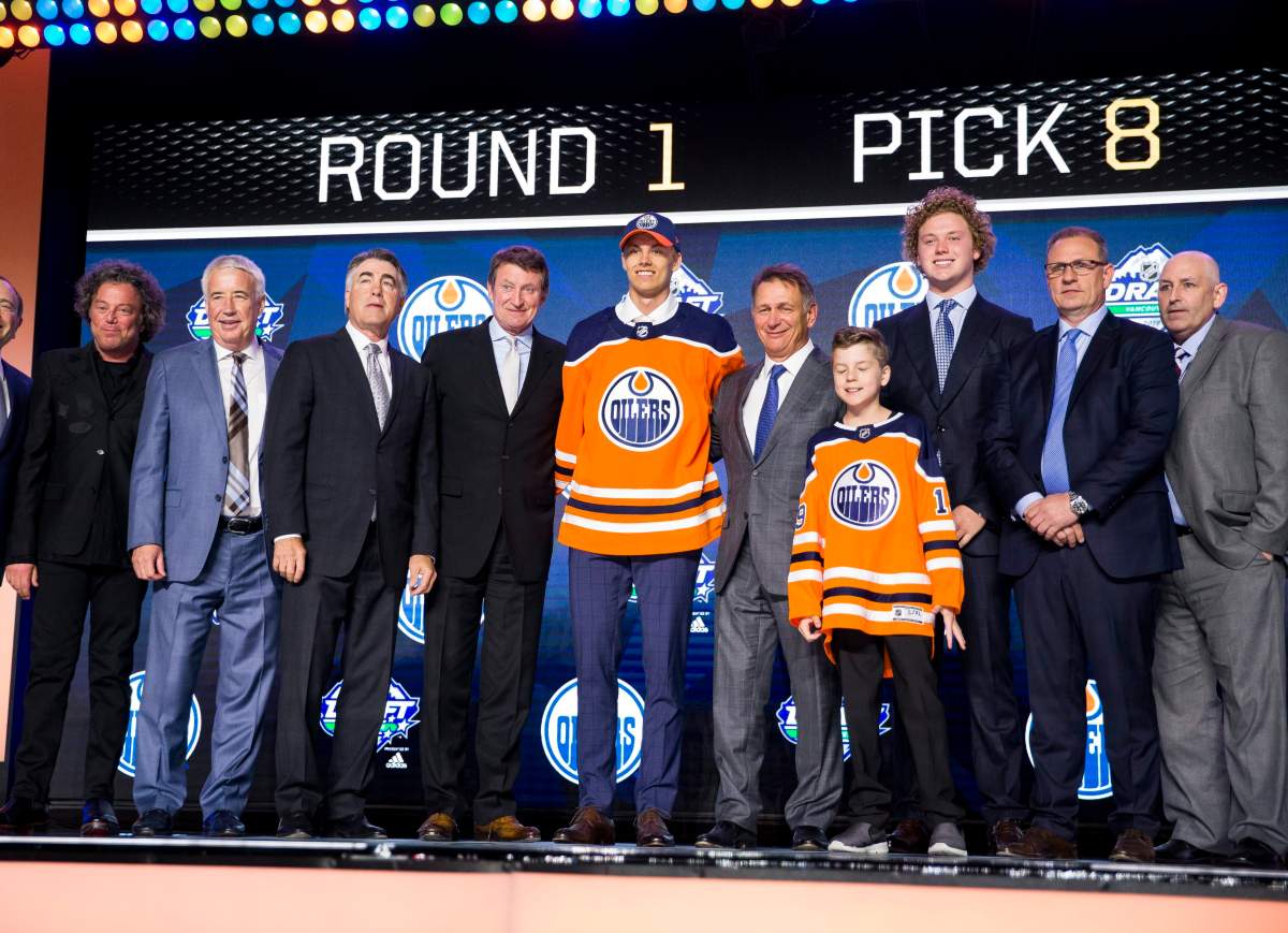 epa07664927 Philip Broberg (C) of Sweden reacts after being selected number eight in the first round of the 2019 National Hockey League (NHL) Draft by the Edmonton Oilers at Rogers Arena in Vancouver, British Columbia, Canada, 21 June 2019.  EPA/BOB FRID SHUTTERSTOCK OUT.