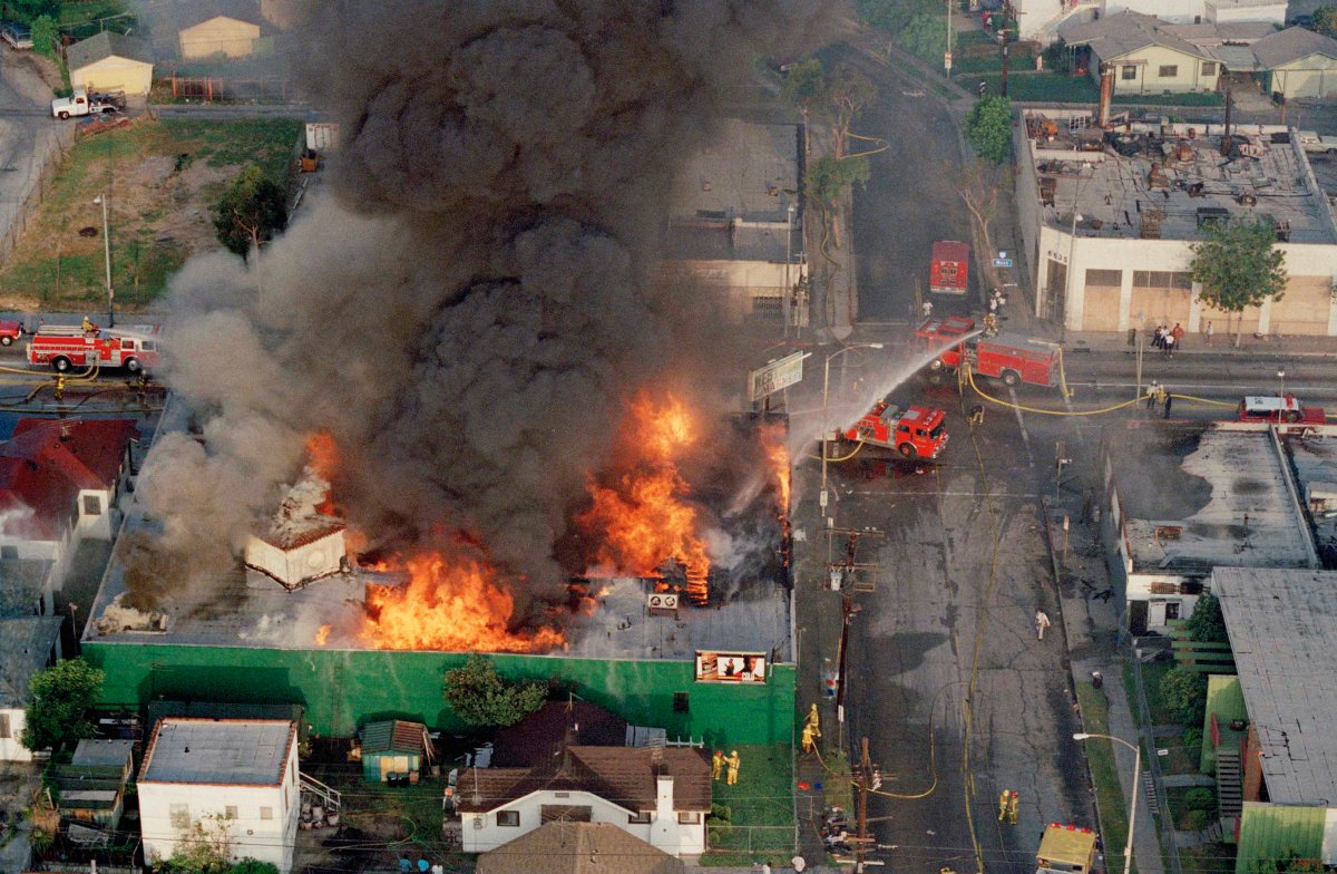 A fire burns out of control at the corner of 67th Street and West Boulevard in South Central Los Angeles on April 30, 1992. The day before, four white police officers were declared innocent in the beating of black motorist Rodney King, and Los Angeles erupted in deadly riots.