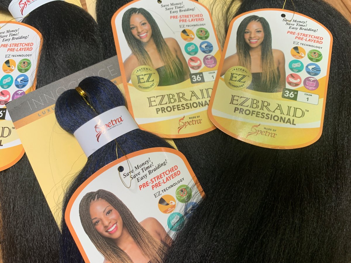 Samples of Pre-stretched Innocence EZBRAND Professional Antibacterial Braid hair extensions from I&I Hair Corporation, purchased in May, are seen in this photo in New York on Wednesday, July 1, 2020. 
