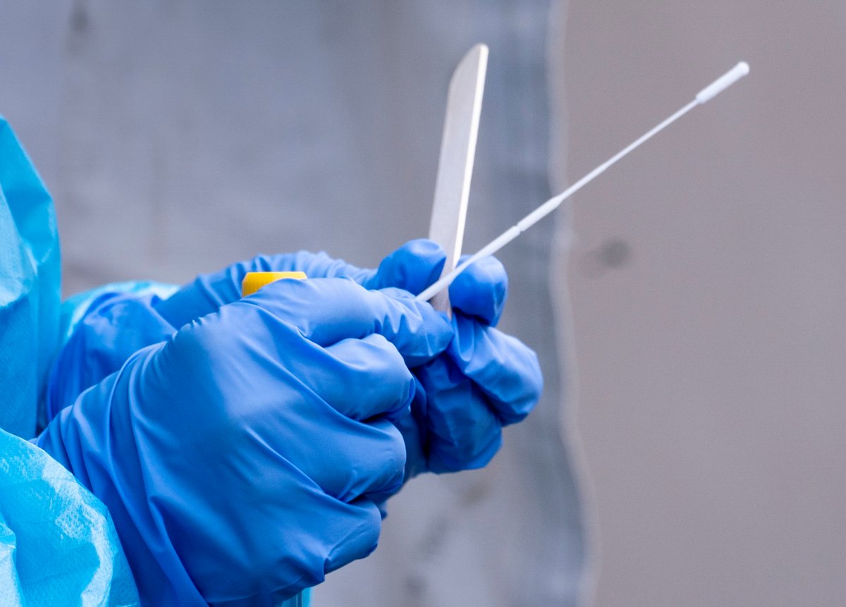 A nurse prepares a swab ready at a temporary COVID-19 test clinic in Montreal, on Friday, May 15, 2020.