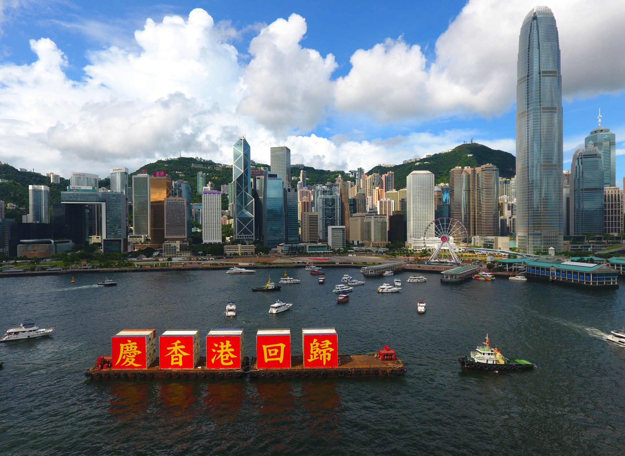 A ship carrying the slogan of "Celebrating the 23rd anniversary of Hong Kong's return to the motherland" sails at the Victoria Harbour in Hong Kong, south China, July 1, 2020.