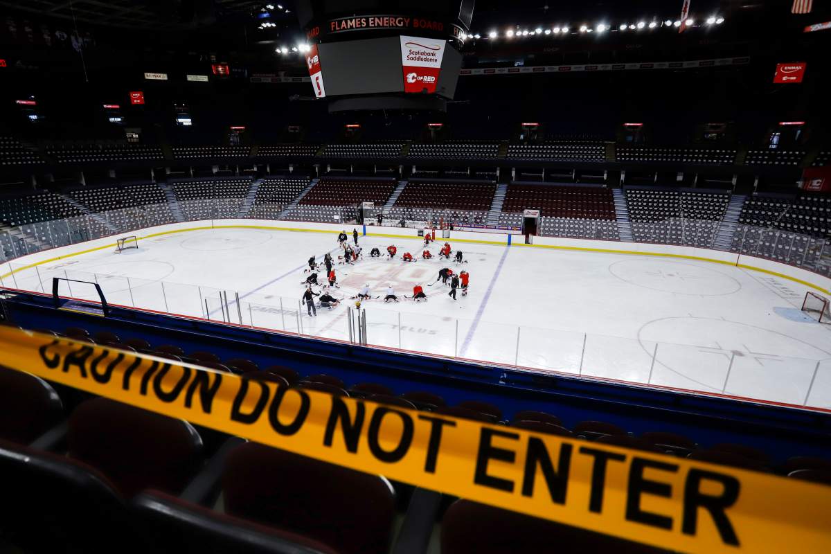 Calgary Flames’ players take to the ice during practice in Calgary, Monday, July 13, 2020.