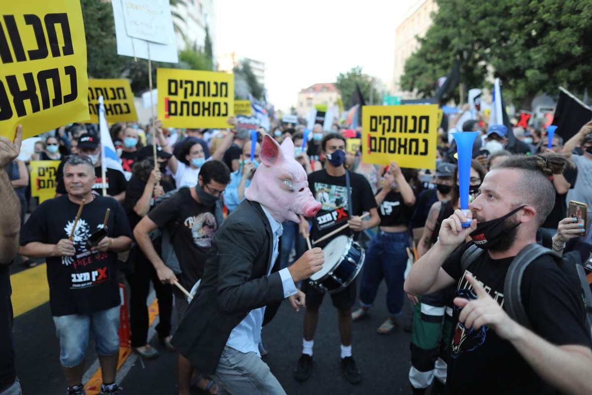 People protest against Israeli prime minister Benjamin Netanyahu due to corruption charges, outside his residence in Jerusalem, Israel, July 14, 2020.