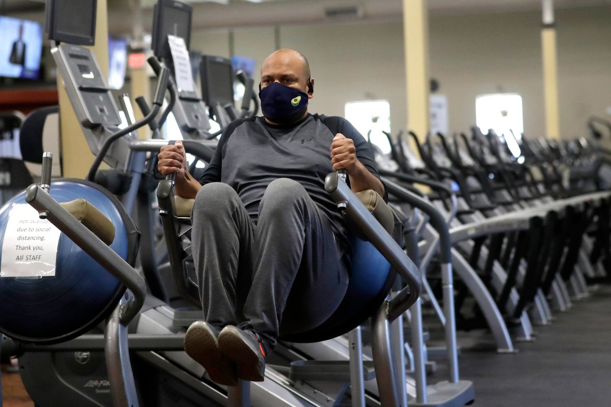 FILE - Earl Edwards, of Canton, Mass., works out on Monday, July 6, 2020, at Answer is Fitness gym.