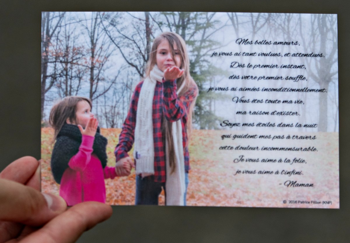 A card distributed by the family depicts Romy, left, and Norah Carpentier, at the funeral home in Levis, Que., Monday, July 20, 2020. Romy and Norah Carpentier were found dead in Saint-Apollinaire, Que.