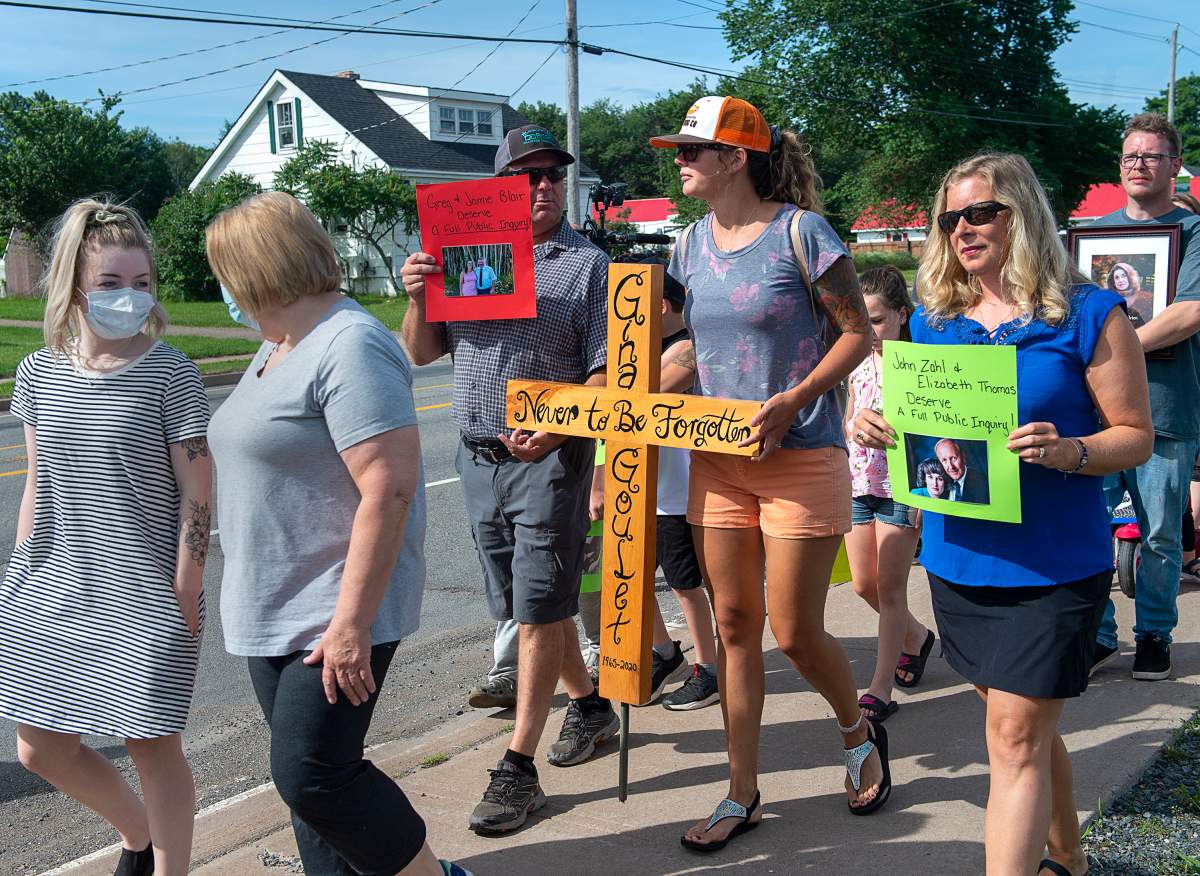 Family and friends of victims attend a march demanding an inquiry into the April mass shooting in Nova Scotia that killed 22 people, in Bible Hill, N.S. on Wednesday, July 22, 2020.