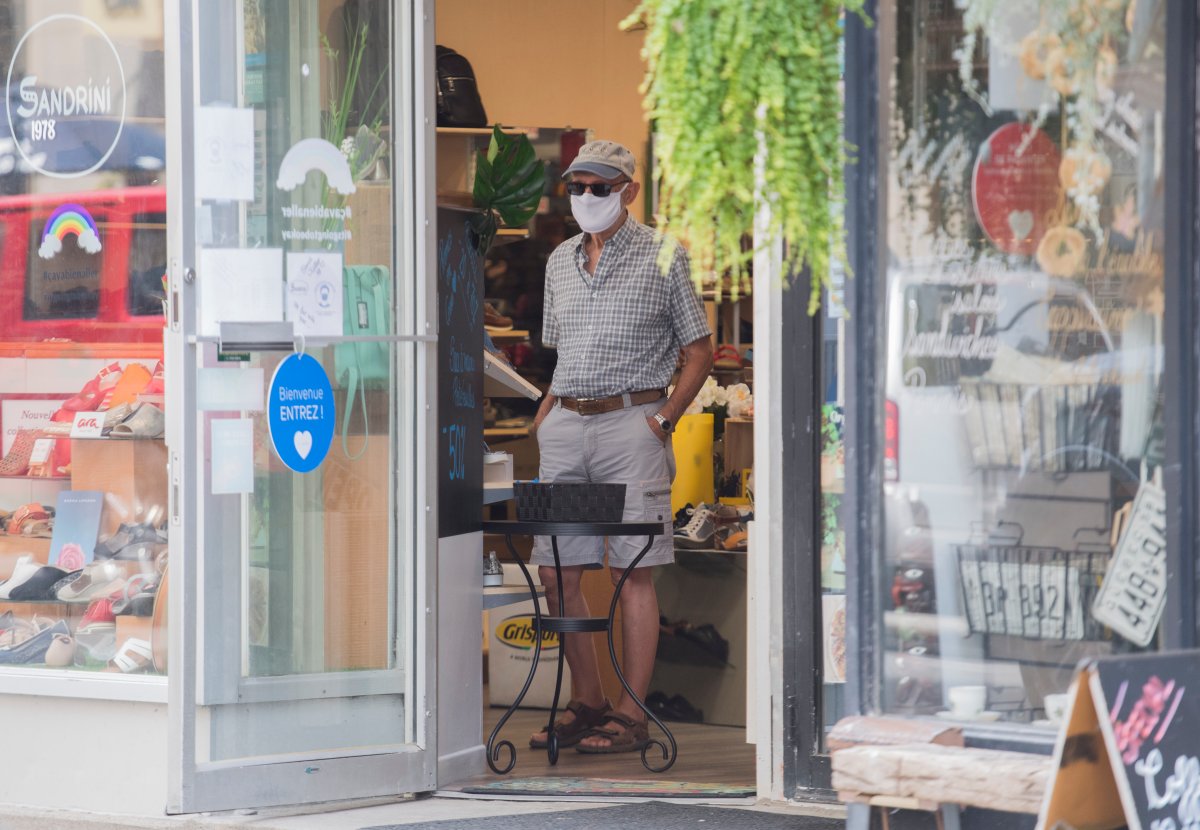 A man wears a face mask inside a store in Montreal, Wednesday, July 22, 2020, as the COVID-19 pandemic continues in Canada and around the world. 